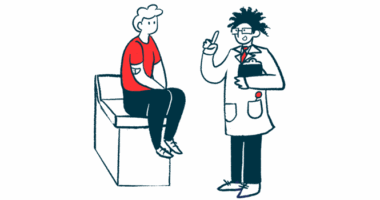 A doctor talks to a patient sitting on the edge of an examination table.