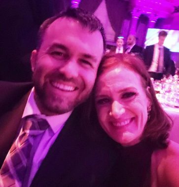 A close-up selfie of Matthew Lafleur and Jen Loga at the dinner table at the MM+M Awards ceremony. Both are smiling broadly, and Jen rests her head on Matthew's left shoulder. 