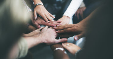 Hands joined together in solidarity