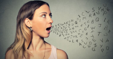 woman talking with randomized letters coming out of her mouth, illustrating speech