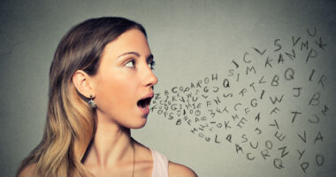 woman talking with randomized letters coming out of her mouth, illustrating speech