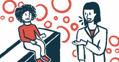A child in a red shirt sits on an exam table, listening to a doctor in a white jacket.