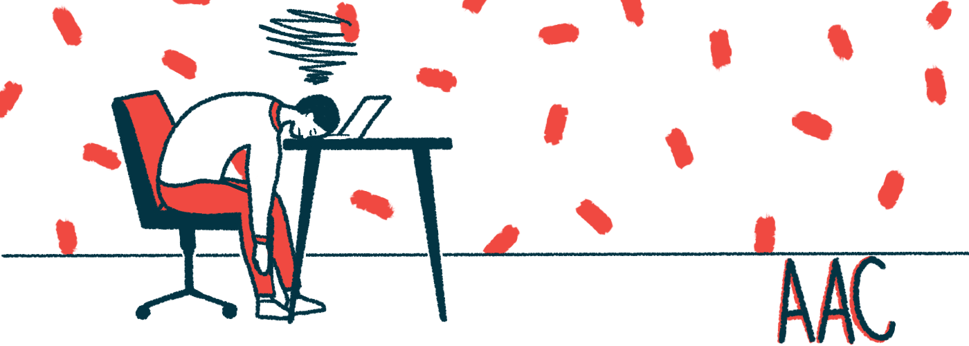 The acronym AAC is seen on the floor nearby a person seated at a table but sleeping on a laptop keyboard.