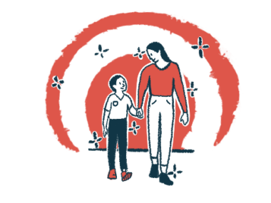 A mother and son walk while holding hands and looking at each other.